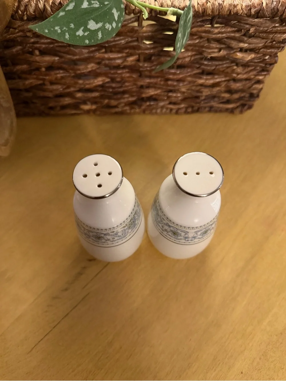 Elegant White Ceramic Salt and Pepper Shakers with Blue Floral Accent